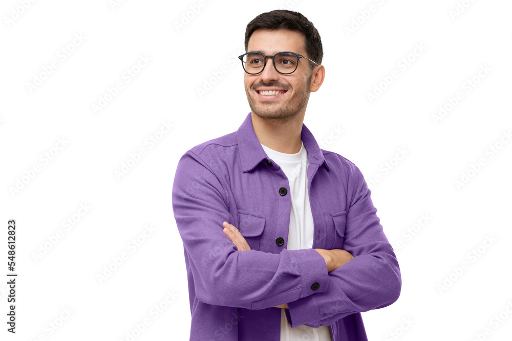 Confident young man looking away, standing with crossed arms isolated on gray Confident young man looking away, standing with crossed arms isolated on gray