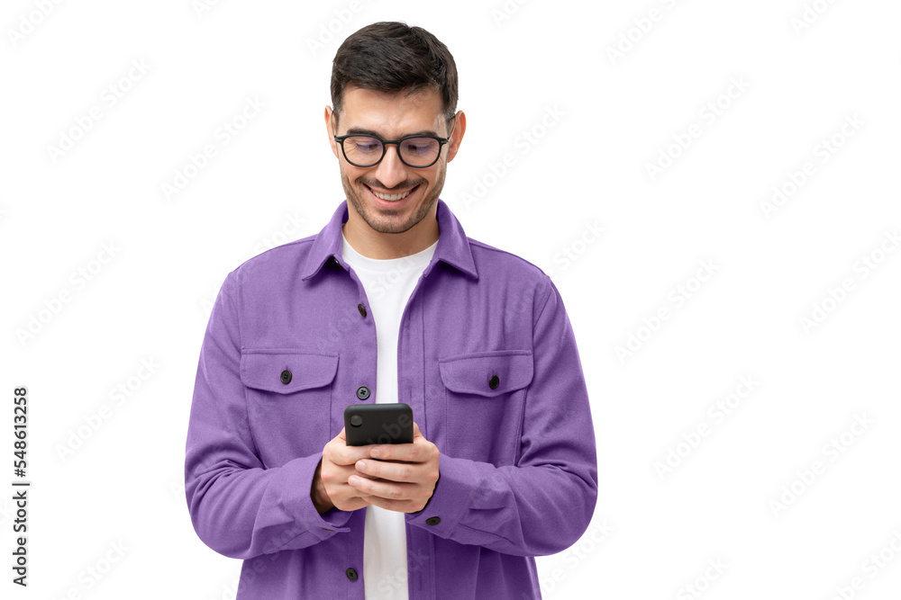 Young happy man looking at his phone - obrazy, fototapety, plakaty 
