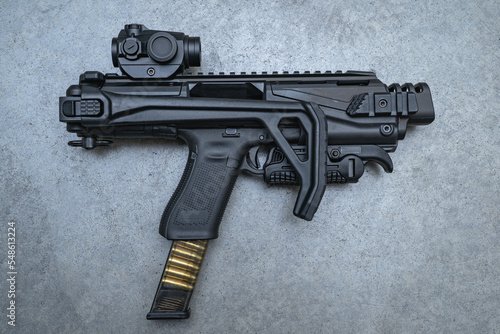 Conversion kit for pistol with red dot sight.