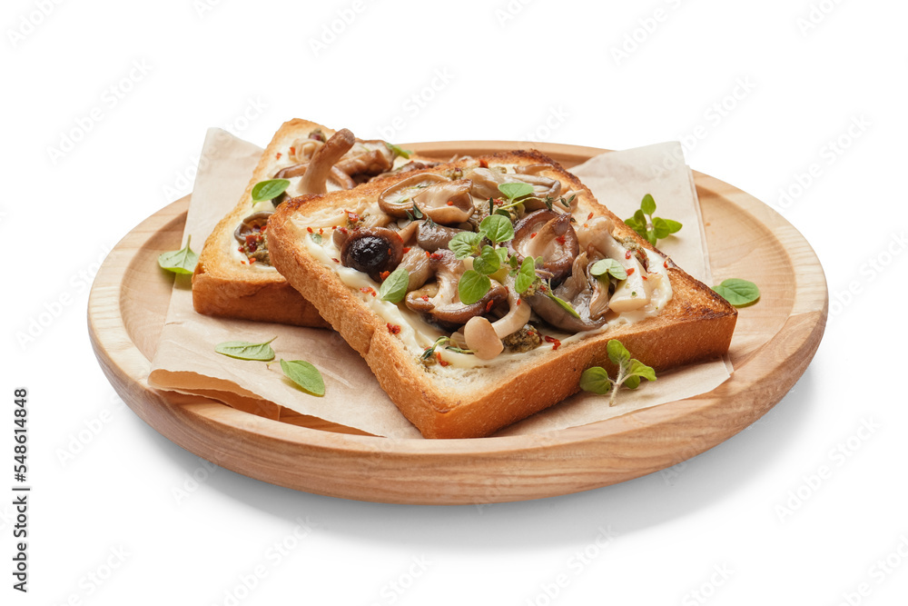 Wooden plate of delicious toasts with cream cheese, mushrooms and pesto sauce on white background