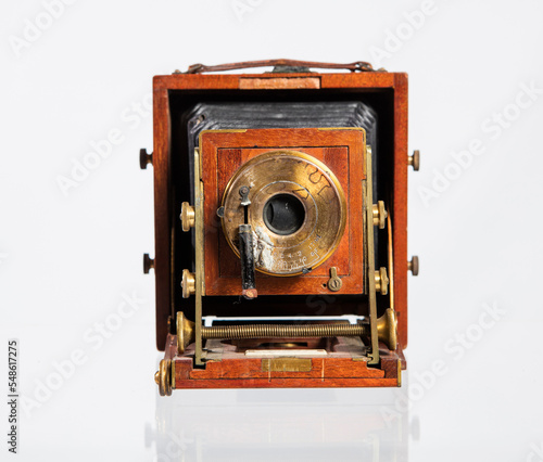 Retro film photo camera isolated on white background