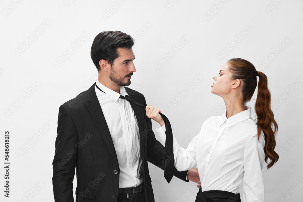 Man and woman anger business hitting on each other screaming with their hands up in the air on a white isolated background. The concept of business in a couple harassment startup copy space Man and woman anger business hitting on each other screaming with their hands up in the air on a white isolated background. The concept of business in a couple harassment startup copy space