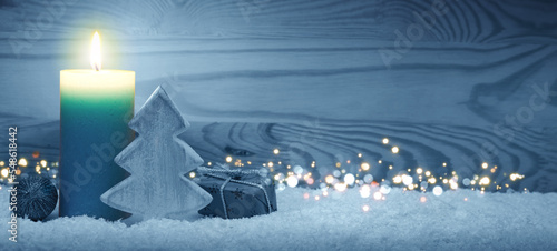 Christmas background with blue Advent candle and decoration