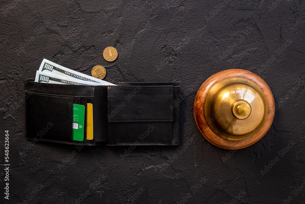 Hotel service bell with wallet and cash. Hotel payment concept
