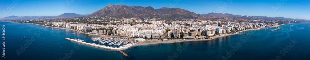 Scenic panoramic view of Spanish coastal city of Marbella by Mediterranean sea in foothills of Sierra Blanca 