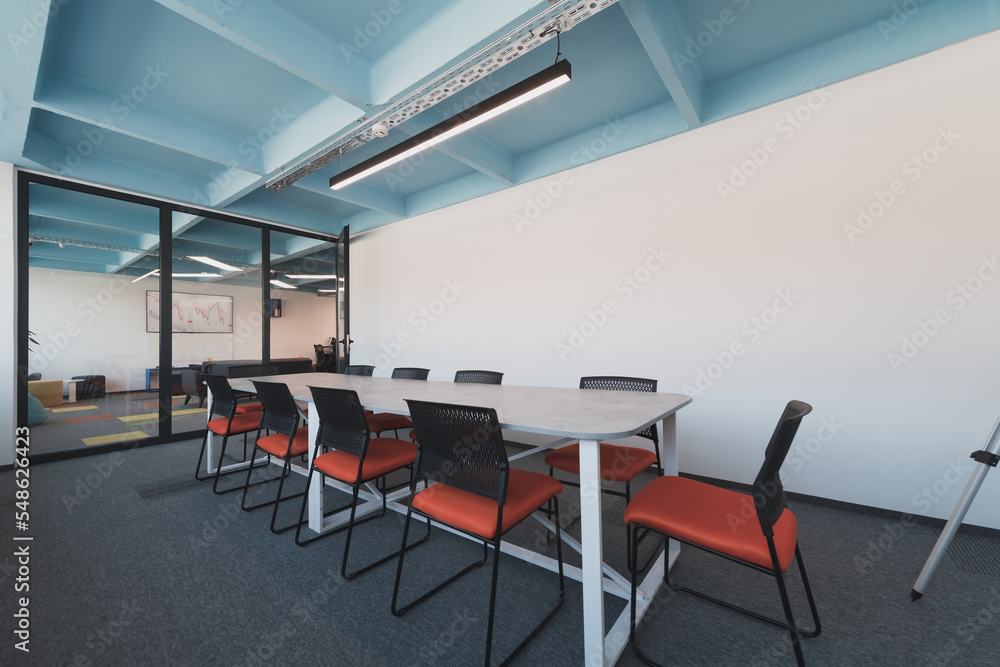 Photo of a modern office where programming, digital marketing and web design projects are done. Office with modern furniture and glass office Photo of a modern office where programming, digital marketing and web design projects are done. Office with modern furniture and glass office