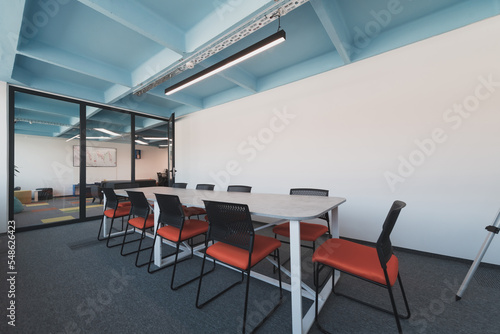 Photo of a modern office where programming, digital marketing and web design projects are done. Office with modern furniture and glass office
