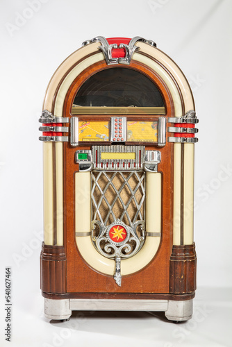 Old jukebox music player isolated on white background photo