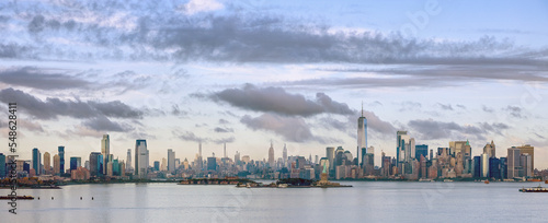 USA, New York, New York City, Panoramic view of city skyline at sunset photo