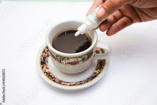 black coffee.  added safe artificial sweeteners for diabetics containing sucrose, fructose, glucose.  artificial sweetener in the form of liquid sugar. photo