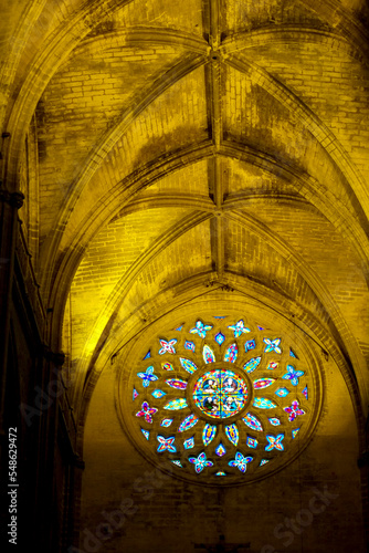Spain, Seville, Multicolored rose window in Cathedral 