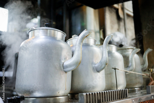 Kettles in old local hookah bar photo