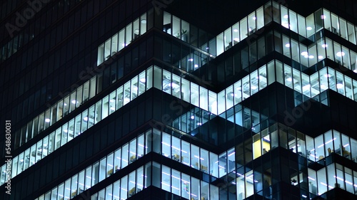 Wallpaper Mural Modern office building in city at the night. View on illuminated offices of a corporate building. Blinking light in window of the multi-storey building of glass and steel. Long exposure at night Torontodigital.ca