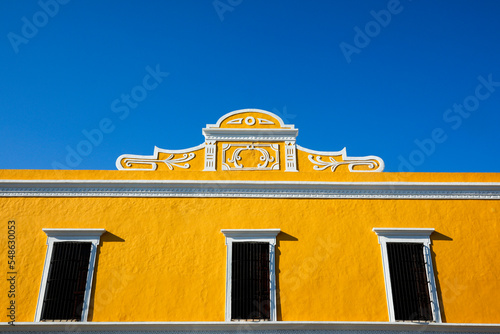 Mexico, Valladolid, Yellow building against blue sky photo