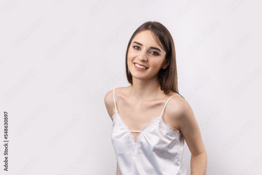 Beautiful smiling woman with clean skin, natural make-up and white teeth on a gray background Beautiful smiling woman with clean skin, natural make-up and white teeth on a gray background
