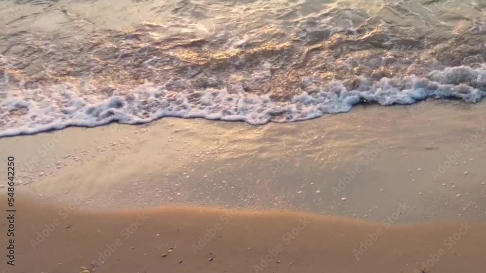 Waves on a sandy beach close-up Waves on a sandy beach close-up