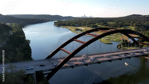 Aerial drone shot overlooking Pennyback bridge in Austin, Texas, USA of Lake Austin on a sunny morning. photo
