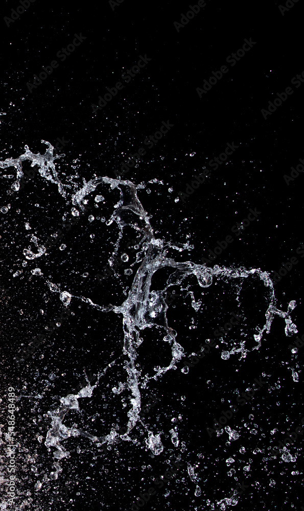 Obraz premium Shape form droplet of Water splashes into drop water attack fluttering in air and stop motion freeze shot. Splash Water for texture graphic resource elements, black background isolated