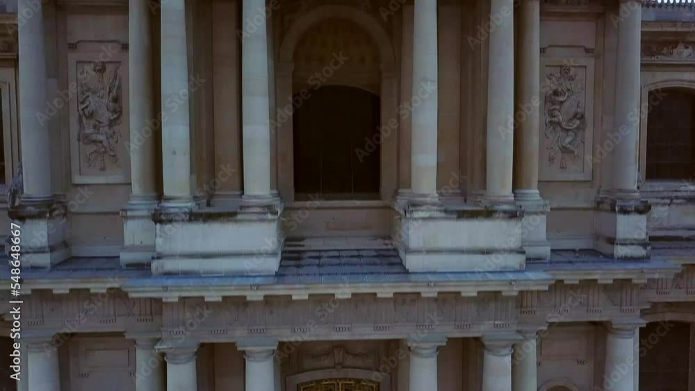 Aerial Tour of Musée de l'Armée, hotel des invalides, featuring golden dome of the cathedral, with Paris city covered with mist at backdrop