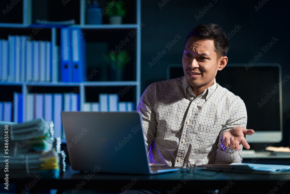 Overtime work concept, Handsome asian business man working late at night in office workplace. Overtime work concept, Handsome asian business man working late at night in office workplace.