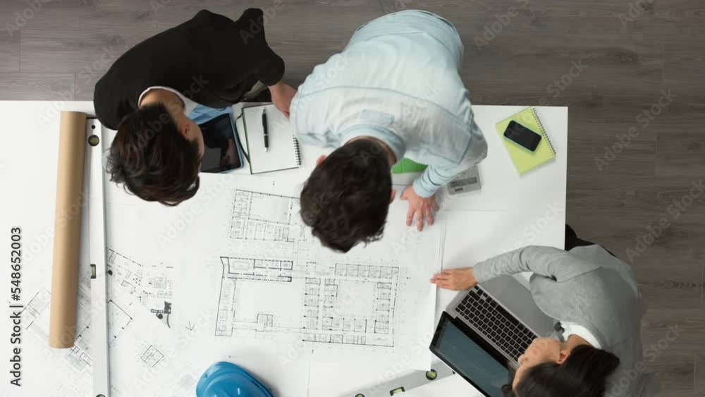 Architect, blueprint and team collaboration for construction and building project, planning strategy and development. Teamwork, engineering and architecture with man and women design group in office