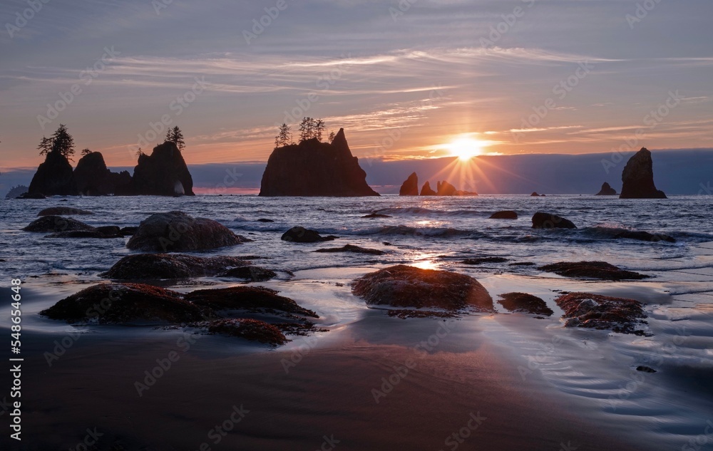 Rocky island in the ocean at sunset. Sea Stacks in Olympic National Park. Washington. USA