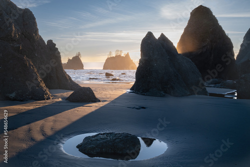 Rocky island in the ocean at sunset. Sea Stacks in Olympic National Park. Washington. USA