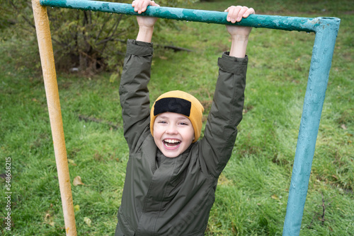 child playing on a swing