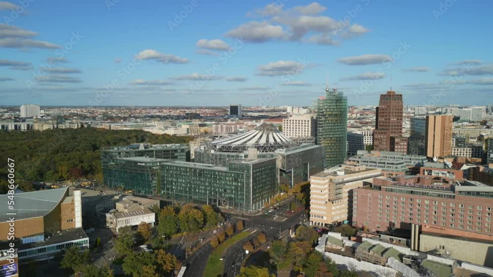 Skyscraper and office building in the city center Berlin. Buttery soft aerial view flight panorama orbit drone downtown at daytime summer 2022. 4k Cinematic Skyscraper and office building in the city center Berlin. Buttery soft aerial view flight panorama orbit drone downtown at daytime summer 2022. 4k Cinematic
