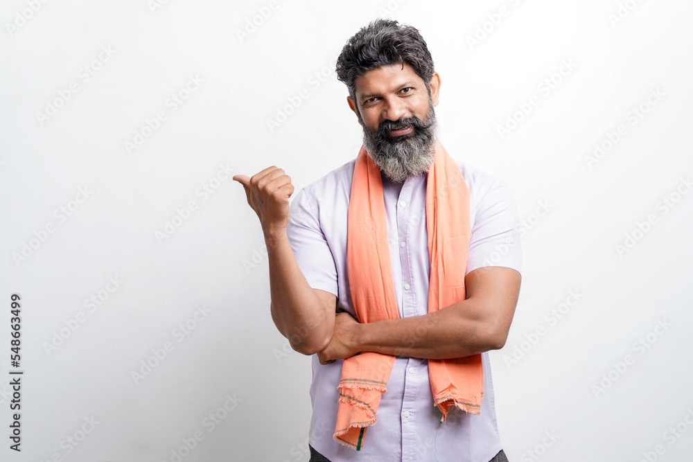 Indian farmer Standing on white background and showing direction with hand. - obrazy, fototapety, plakaty 