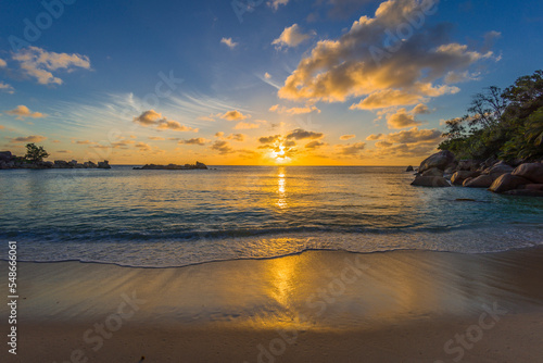 Sunset on Petite Anse beach on Praslin island in Seychelles.