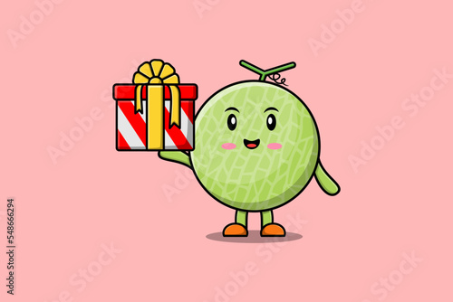 Cute cartoon Melon character holding gift box in vector icon illustration