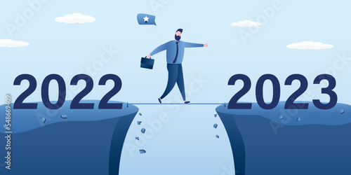 Year 2023 hope, new year resolution or success opportunity, overcome business difficulty, ambitious businessman walks tightrope over an abyss from 2022 to 2023 year