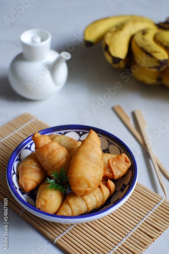 a plate of fried banana pastry 