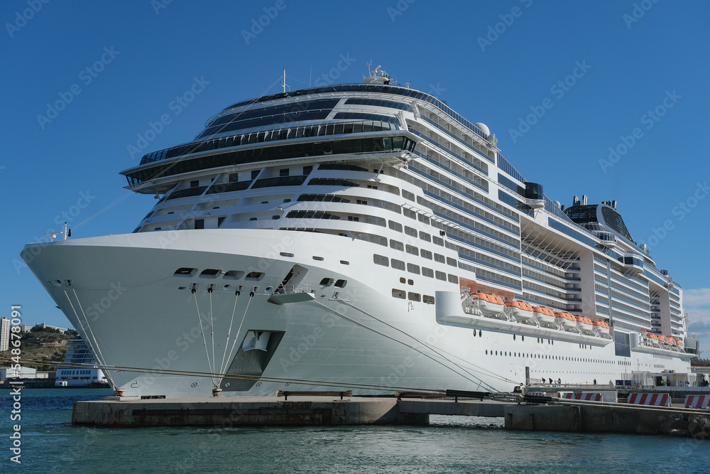 MSC cruiseship or cruise ship liner Grandiosa in Marseille Provence port during sunrise twilight blue hour Mediterranean cruise dream vacation MSC cruiseship or cruise ship liner Grandiosa in Marseille Provence port during sunrise twilight blue hour Mediterranean cruise dream vacation