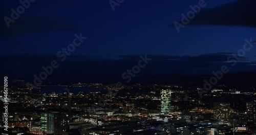 Wallpaper Mural High viewpoint night-time footage of Zurich city Switzerland, Europe. Low light, partially cloudy sky, city lights Torontodigital.ca
