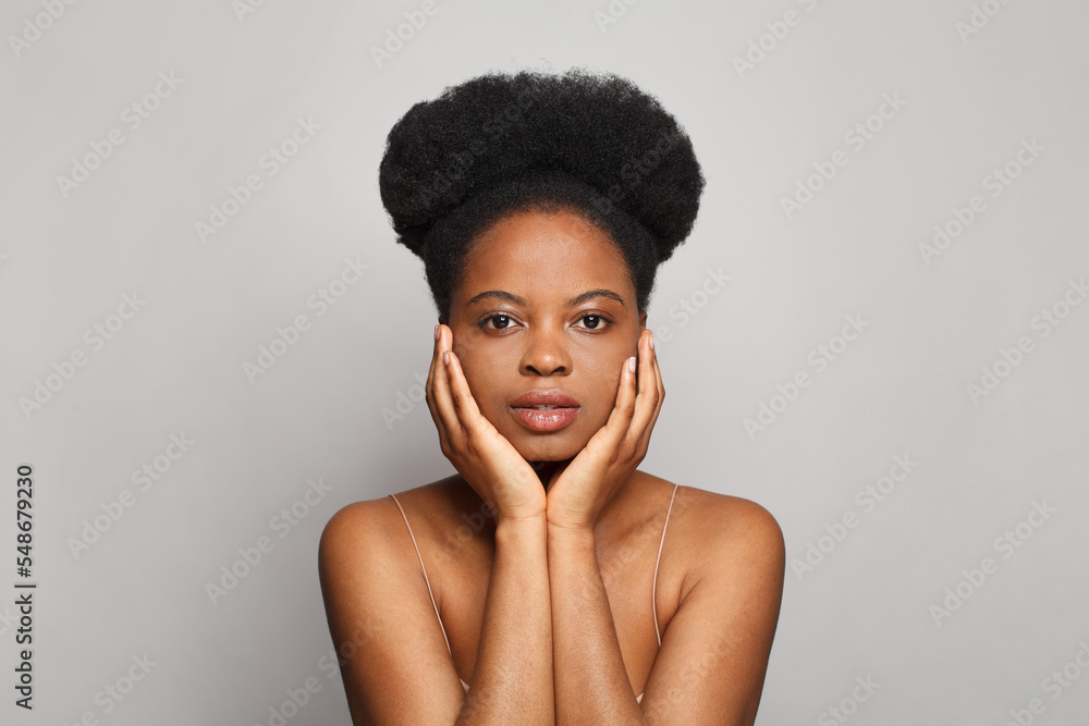 Attractive female face. Pretty woman with fresh clean skin on white background. Facial treatment and skin care concept Attractive female face. Pretty woman with fresh clean skin on white background. Facial treatment and skin care concept