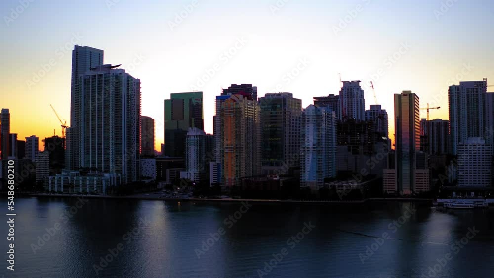Aerial Beautiful View Of Buildings Against Clear Sky, Drone Flying Forward Over Sea At Sunset - Miami, Florida Aerial Beautiful View Of Buildings Against Clear Sky, Drone Flying Forward Over Sea At Sunset - Miami, Florida