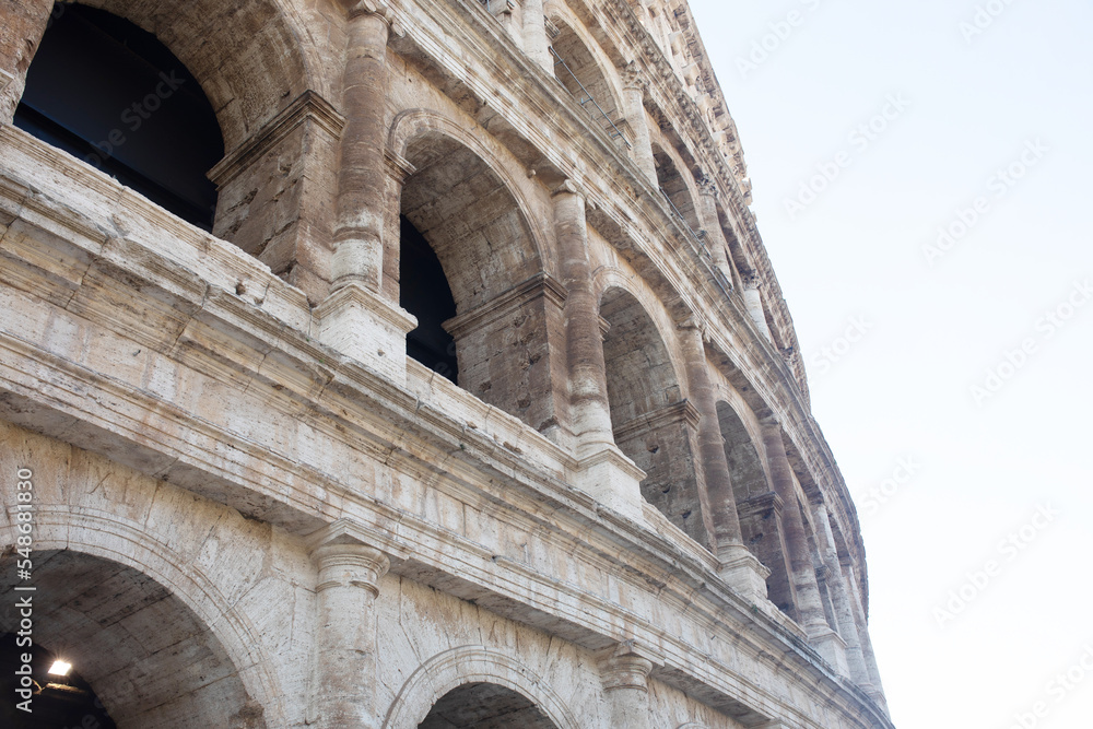 Coliseum (Colosseum), Rome, Italy. Ancient Roman Coliseum is famous landmark, top tourist attraction of Rome. Scenic view of Coliseum with blue sky.