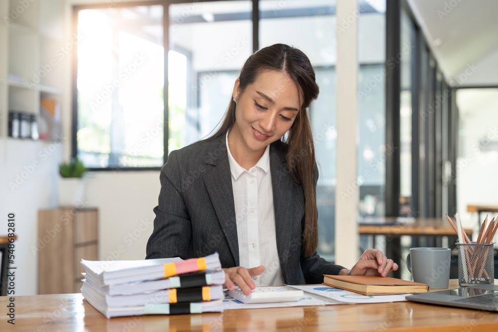 Asian bookkeeper or financial inspector hands making report, calculating or checking balance. Home finances, investment, economy, saving money or insurance concept Asian bookkeeper or financial inspector hands making report, calculating or checking balance. Home finances, investment, economy, saving money or insurance concept
