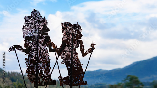 Black shadow silhouette of old traditional puppets of Bali Island - Wayang Kulit. Culture, religion, Arts festivals of Balinese and Indonesian people. Travel background photo