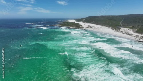 Aerial footage of a vast blue ocean in Platboom Beach, South Africa, in sunny weather photo