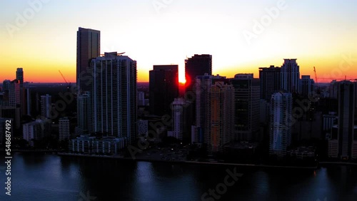 Wallpaper Mural Aerial Panning Shot Of Residential Building Against Orange Sky, Drone Flying Over Ocean During Sunset - Miami, Florida Torontodigital.ca