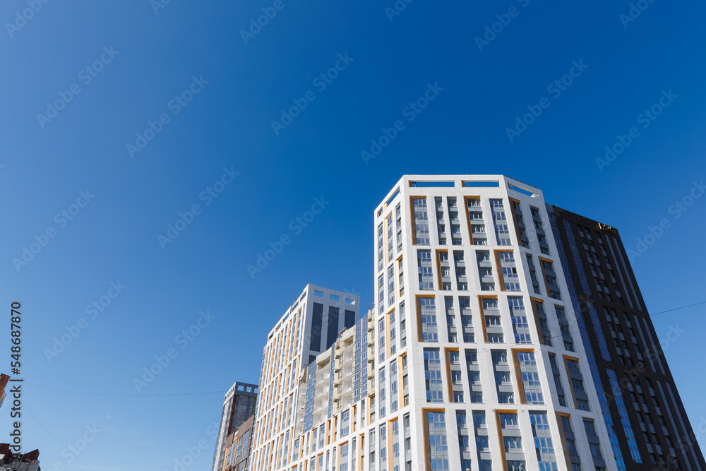 A new high-rise building against the blue sky. A new high-rise building against the blue sky.