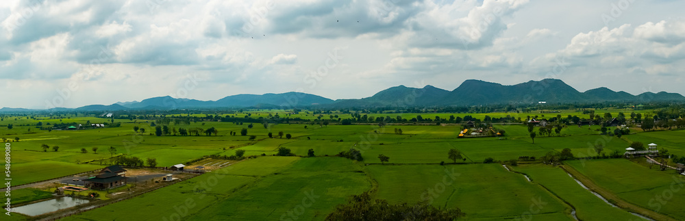 rice fields, sky and mountains High angle view of Tiger Cave Temple Kanchanaburi, Thailand