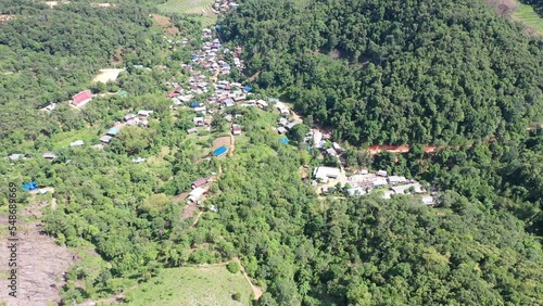 High angle view of a northern rural village in the valley Ban Thung Ton Ngio,  Mae Tuen, Omkoi district, Chiang Mai, Thailand. photo