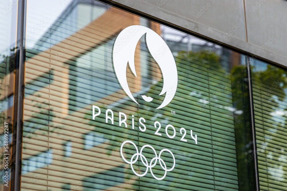 Paris 2024 Olympics logo on the window pane of a building entrance in ...