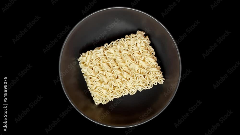 Noodles instant, uncooked raw, top view, in dark gray bowl, isolated on black background rotating, turning, close-up macro, top view
Noodles instant, uncooked raw, top view, in dark gray bowl, isolated on black background rotating, turning, close-up macro, top view