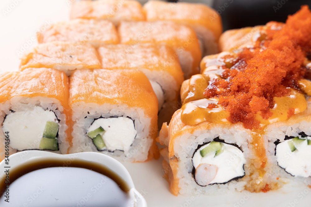 sushi and rolls on an orange background sushi and rolls on an orange background