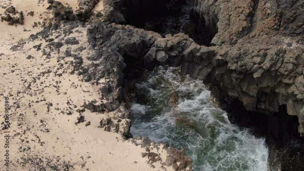 Aerial shot approaching one of the Caletones arches located on the island of La Graciosa. Canary islands spain. Aerial shot approaching one of the Caletones arches located on the island of La Graciosa. Canary islands spain.
